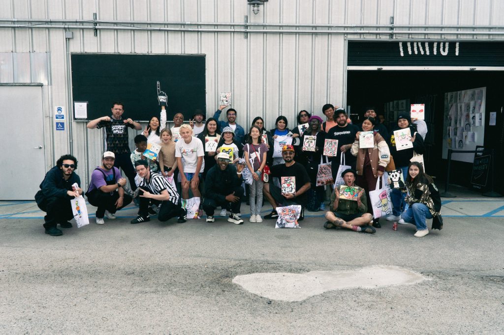 Artist Upendo with workshop attendees after leading a workshop with Secret Walls X POSCA (Photo: Emmett Methven)