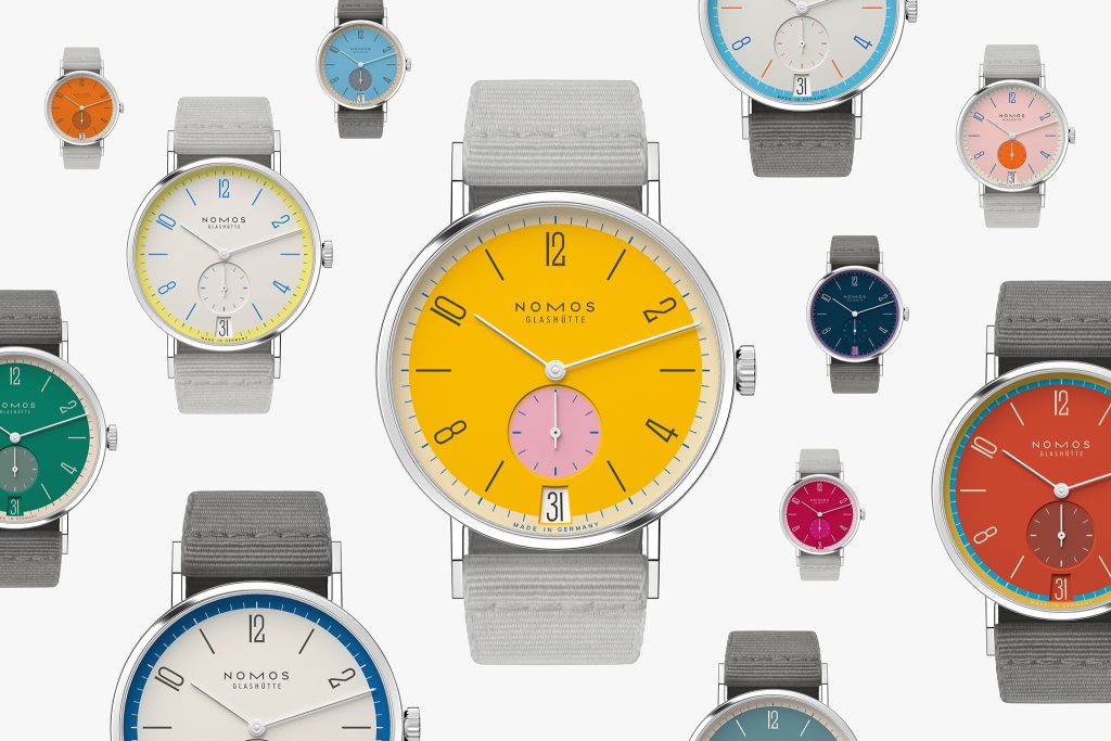 The NOMOS icon in color: Tangente 38 date Katzengold