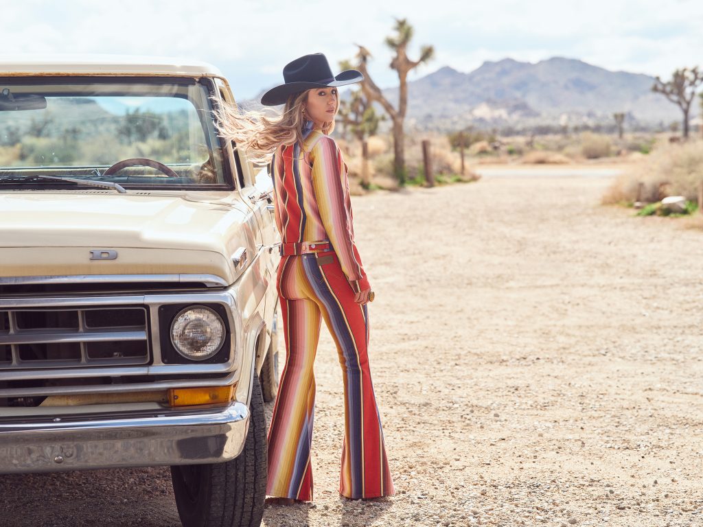 Next-generation country icon Lainey Wilson's creative energy saddles up with Wrangler's Western heritage to bring consumers a joyful patchwork of contemporary cowgirl style. (Photography by Zoey Grossman, courtesy of Wrangler®.)