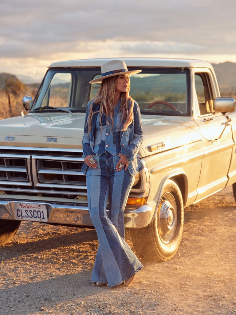 Showstopping pieces include Wilson's signature bell bottom jeans, elevated with statement patchwork, bold stripes and flock embellishments. Trucker jackets and flares come in printed "storyteller" denim, with illustrations based on details from Wilson's life, from her childhood spent on her family's Louisiana farm, to her guitar and beloved French bulldog. (Photography by Zoey Grossman, courtesy of Wrangler®.)