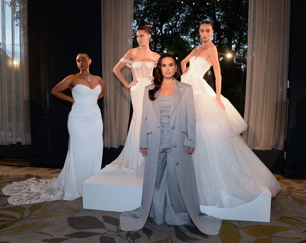 Demi Lovato and models at the Christian Siriano. Photo by Michael Simon/Getty Images for Christian Siriano Bridal for Azazie.