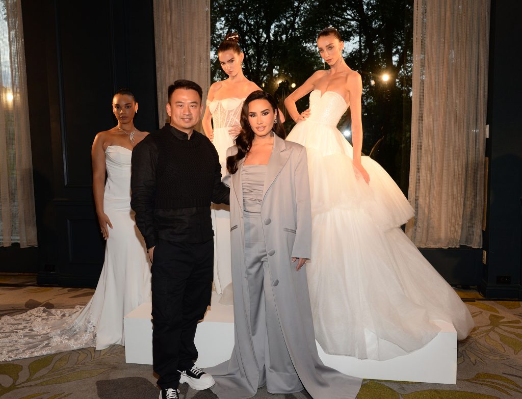 Azazie Founder and CEO Charles Zhong, Demi Lovato and models at the Christian Siriano for Azazie 2024/2025 Bridal Show Presentation. (Photo courtesy of Azazie.)