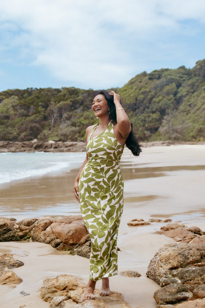 ALEXIS MAXI DRESS - GREEN FLORAL
 Its elegant maxi length cascades beautifully, while the halter neckline with a secure button closure adds a touch of modern sophistication. The asymmetrical neckline brings a unique edge, perfectly balanced by the comfort of an elasticised shirred panel at the back for a flawless fit.