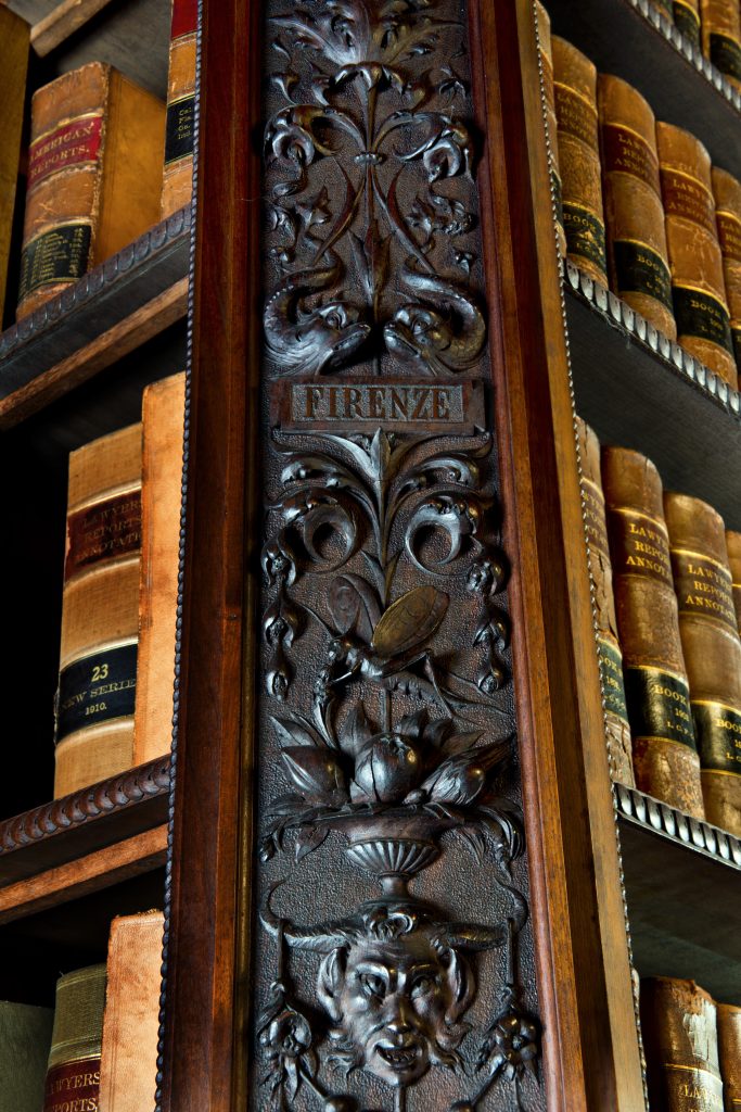  The Chateau-sur-Mer Library Luigi Frullini Carvings 
A carved wooden panel in the Chateau-sur-Mer Library contains the name "Firenze" or Florence, the city of the artist Luigi Frullini (1839-1897) whose carvings decorate the entire room. Photo courtesy of The Preservation Society of Newport County.